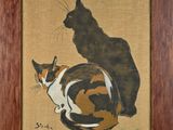 a picture of a cat and a cat sitting together