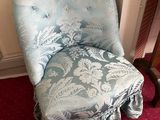 a chair that is sitting in the corner of a room