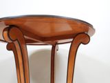 a wooden table with a glass top on a white background