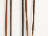 several different types of sticks are arranged on a white surface