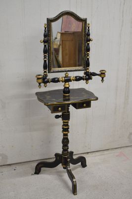 a mirror on a stand with a mirror on top of it