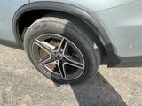 a close up of a car ' s tire on the road