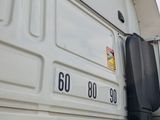 a large white truck parked on the side of the road