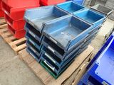 many blue and red bins sitting on a pallet
