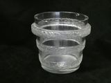 a clear glass vase with a decorative design on it