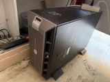 a small black computer on a table in a room