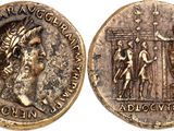 a gold coin with an image of a man and a woman on it