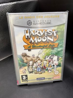 Le jeu Nintendo « Harvest Moon » est posé sur une surface noire