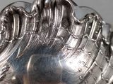 a silver spoon that is sitting on top of a table
