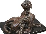 statue of a woman with a dog on a black marble base