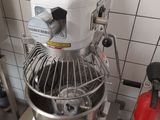 an image of a mixer in a kitchen with a fire extinguisor nearby