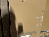 a cardboard box sitting on top of a box with a number on it