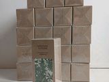 a stack of boxes with a picture of a plant on them