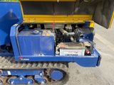 an image of a blue tractor with a yellow trailer