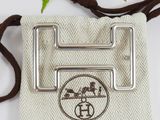a small bag with a metal buckle on it