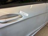 a car door handle with a sticker on it