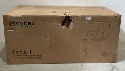 a cardboard box with a hole in it on the floor