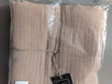 a close up of a pair of folded towels on a table