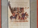 framed picture of a painting of a group of men on horseback