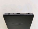 a close up of the back of a cell phone on a table