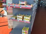 a shelf with a lot of items on it in a store