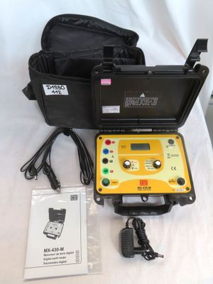 a yellow and black electronic device sitting on a white table