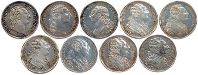 six different types of silver coins are shown on a white background