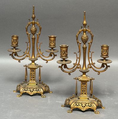 pair of antique brass candelabs with candles on stands