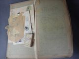 a book open with a lot of papers on it