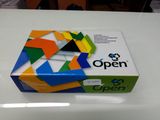 an open box of colorful paper sitting on top of a white table