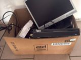 a box with a computer monitor and other electronics in it
