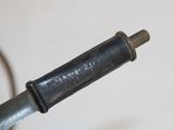 a small metal object with a screw on top of it