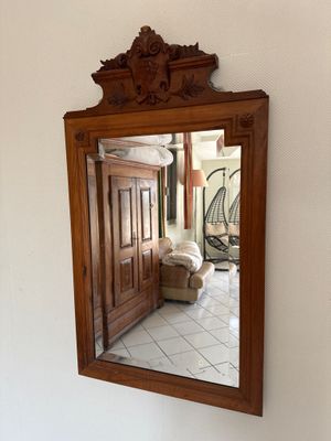 a mirror hanging on the wall in a room