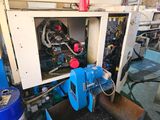 a picture of a machine that is working on a piece of machinery