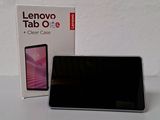 lenovo tab oe tablet with box on table next to it