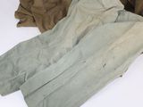 two pairs of pants are sitting on a table next to each other