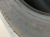 a close up of a tire on a white surface