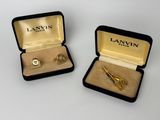 paire de montres-bracelets Lanvin plaquées or et une pince à cravate, dans un étui en velours
