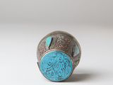 an image of a silver ring with a turquoise stone in the center