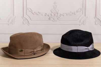two hats that are sitting on a table