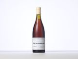 a bottle of wine that is sitting on a table
