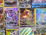 many different types of pokemon cards on the table