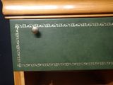 a green drawer with a book on top of it