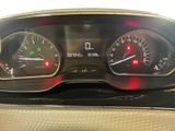 a close up of a car dashboard with various gauges