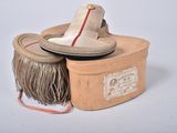 a small box with a pair of shoes on top of it
