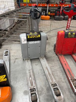 many different types of forklifts in a warehouse