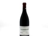 a bottle of wine that is sitting on a table