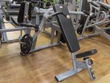 a gym with a lot of equipment in the room