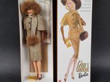 doll in a cardboard box with a fur coat and a fur stoler