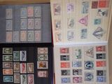 many different types of stamps displayed on the wall
